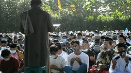 Hundreds of Muslims gather on field in Indonesia to perform Eid prayers