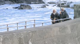House of Dragon Actors enjoy a candid snack as they return from the boat ride back to the mainland at Marazion from St Michael`s Mount.