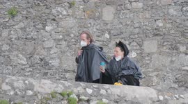 Black clad House of Dragon supporters of Rhaenyra Targaryon. The actors just out of the boat bringing them back from the St Michaels Mount film location.