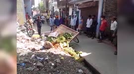 Police officials allegedly flip vegetable vendor's cart into roadside drain in central India