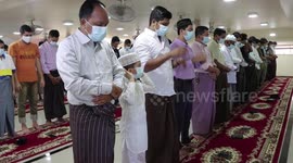 Muslims in Yangon perform prayer as an Eid celebration during military coup
