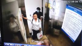 Chinese woman prevents man from bringing electric bike into lift due to safety reasons