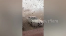 Sandstorm and rain engulfs buildings in Saudi Arabia