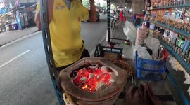 Street food stalls sell grilled baby stingray in Thailand