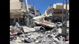 Destroyed Gaza and a funeral ceremony