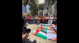Funeral ceremony in a ruined city of Gaza