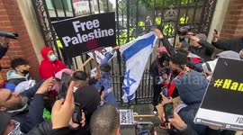 Palestinian protesters burn Israeli flag at gates of London embassy