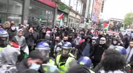 Police shove demonstrators outside Israeli Embassy in London
