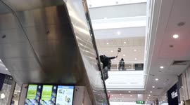 Free Palestine Protester Climbs On The Rail Of An Escalators In Manchester Arndale Shopping Centre