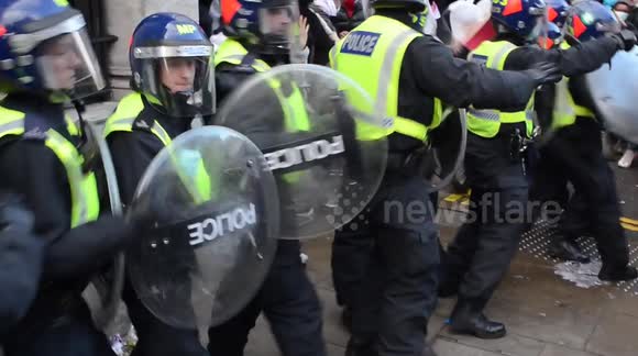 Violent clashes after Police rush in to end a Palestine protest outside the Israeli Embassy, Kensington, London.