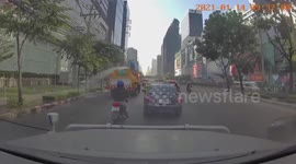 Fire truck accidentally sprays water on parked taxis