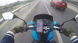 Motorbike rider ushers lost dog on motorway back to safety in Thailand