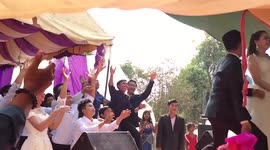Cambodian groom throws bouquet and falls off stage in hilarious wedding karma