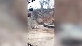 Landslide crashes to the ground in front of lorry in Thailand