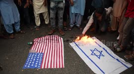 US and Israeli flags burned at Gaza protest in Karachi, Pakistan