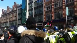 Protester throws egg as riot police prepare to go in to break up protest