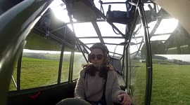 Schoolgirl landinng a WW2. Aircraft in a crosswind