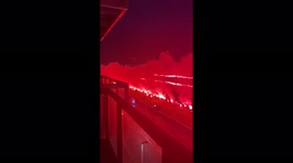 Rangers fans setting off red flares on River Clyde in Glasgow