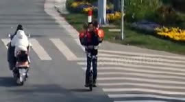 Chinese father rides unicycle while carrying his kids in both hands