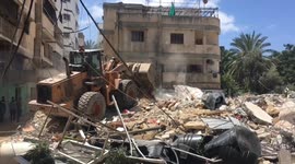 Excavators used in Gaza to clear huge mounds of rubble created by airstrikes