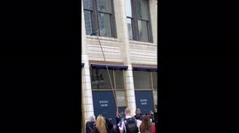 Heroic scene shows pet bird being rescued by Chicago firefighters in front of a massive crowd