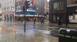 Hellacious rain hammers London's West End on same day theaters reopen