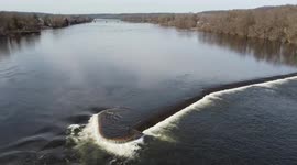 Man fly fishing in the middle of Delaware River
