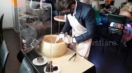 Las Vegas Italian restaurant owner shows how to make cheese sauce with a blow torch