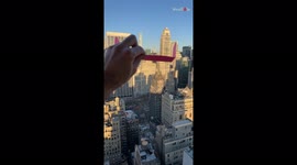 Satisfying footage shows engineer launch paper plane from 48th floor NYC apartment