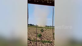 Dust devil tornado whips through field in the Philippines