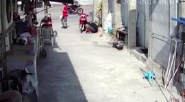 Motorcycle bursts into flames while rider tries to fix it