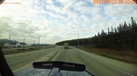 Sleeping driver almost hit by semi truck