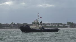 Harbour tugs heading out in rough weather with a force 6 wind