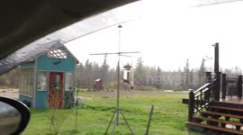 Man films simultaneous rain shower and dry weather happening on both sides of his car