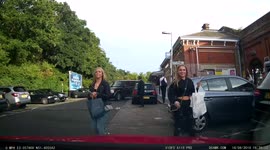 Lady checked both ways and checks behind her car  again then reverses and hits another car, she then facepalms herself
