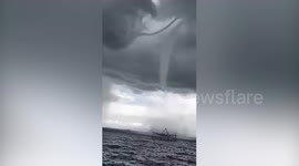 Huge waterspout looms over beach in the Philippines