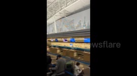 Passengers Wait In Line For Several Hours Following American Airlines, JetBlue Global System Outage