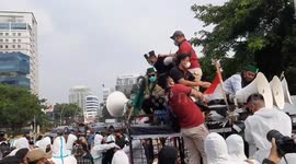 Chaotic scenes outside US Embassy in Jakarta as Indonesia Muslims protest over Israel air strikes