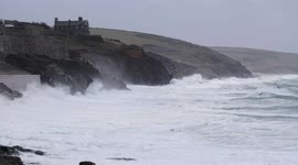 Gale force winds whip up big waves and sea form at Porthleven in Cornwall