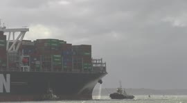 Ultra large container ship Ever Golden arrives at the UK port of Felixstowe, force 6 wind, 20 May 2021