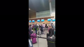 Passengers wait in line several hours following American Airlines, JetBlue system outage