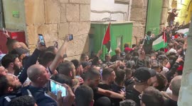 Palestinians celebrate in the streets following a ceasefire between Israel and Hamas