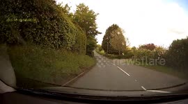 Wooden planks fall off the back of a van and nearly hit two cars coming the opposite way in Worcestershire, UK.