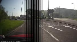 Two police motorbikes chase after a car on dual carriageway