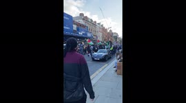 Free Palestine protesters smash up car on High Street Kensington- it’s now kicking off .... police and protesters clashing