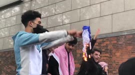 FREE PALESTINE protesters burn multiple Israeli flags outside the Israeli embassy in London