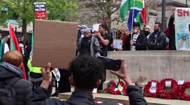 Free Palestine Protesters Stand On The War Memorial In Manchester On The Anniversary Of The MEN Arena Bombing