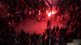 PAOK fans celebrate wildly after team wins Greek Cup against champion Olympiacos