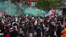 Free Protesters Set Of Flares Whilst An Activist Gives A Speech. In Manchester Piccadilly Gardens