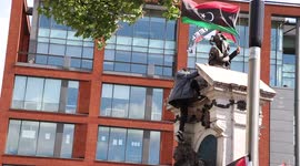 Protester Joins His Friend On Top Of The Statue At Free Palestine Protest. In Piccadilly Gardens, Manchester